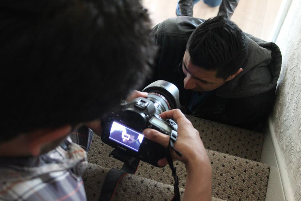 In front of the camera