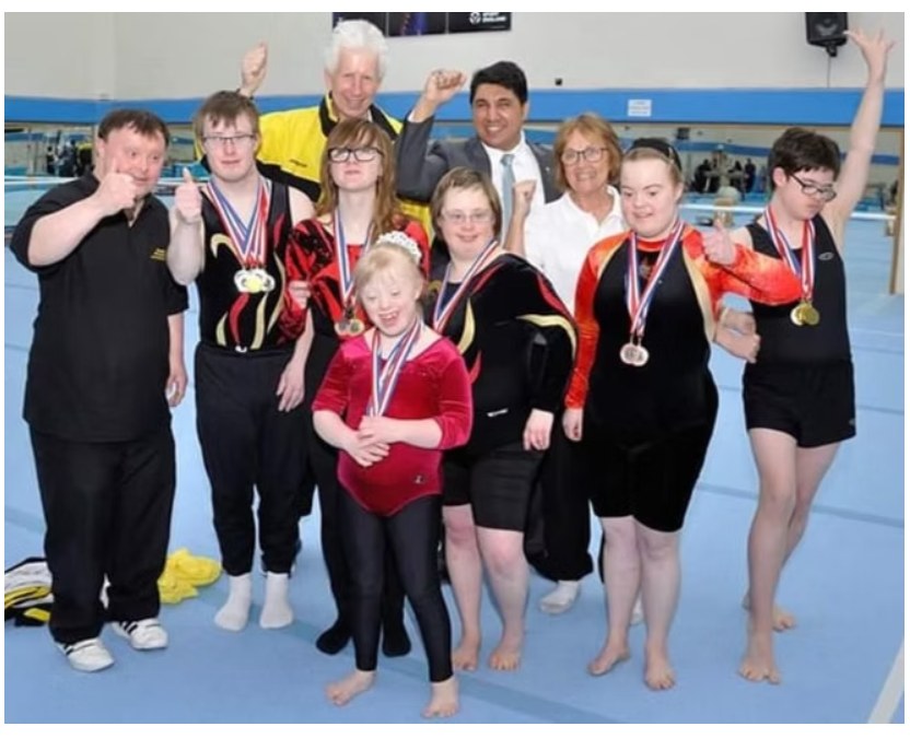 Mak Singh with medal-winning athletes at the Special Olympics West Midlands regional gymnastics competition